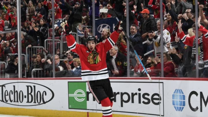 CHICAGO, IL - MARCH 21: Erik Gustafsson #56 of the Chicago Blackhawks reacts after scoring against the Philadelphia Flyers in the first period at the United Center on March 21, 2019 in Chicago, Illinois. (Photo by Bill Smith/NHLI via Getty Images)