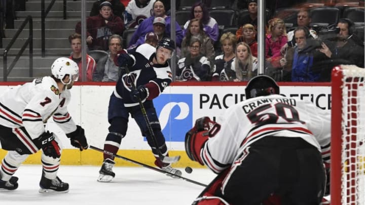 DENVER, CO - MARCH 23: Colorado Avalanche center Carl Soderberg (34) firs a shot towards Chicago Blackhawks goaltender Corey Crawford (50) in the first period at the Pepsi Center March 23, 2019. Chicago Blackhawks defenseman Brent Seabrook (7) defends. (Photo by Andy Cross/MediaNews Group/The Denver Post via Getty Images)