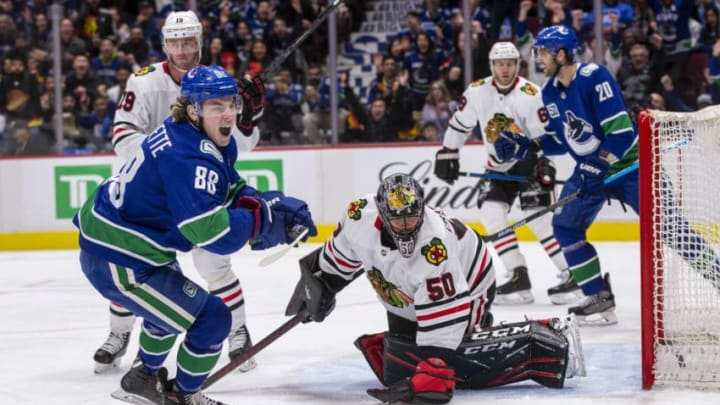 VANCOUVER, BC - FEBRUARY 20: Adam Gaudette #88 of the Vancouver Canucks scores against goaltender Corey Crawford #50 of the Chicago Blackhawks during the second period at Rogers Arena on February 12, 2020 in Vancouver, Canada. (Photo by Ben Nelms/Getty Images)