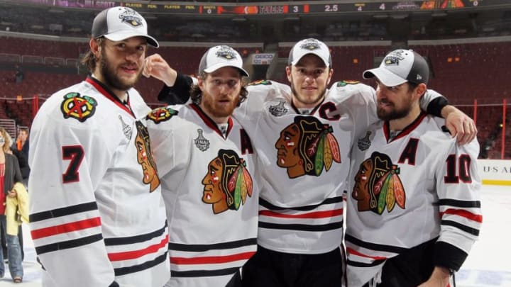 PHILADELPHIA - JUNE 09: (L-R) Brent Seabrook #7, Duncan Keith #2, Jonathan Toews #19 and Patrick Sharp #10 of the Chicago Blackhawks celebrate after the Blackhawks defeated the Philadelphia Flyers 4-3 in overtime to win the Stanley Cup in Game Six of the 2010 NHL Stanley Cup Final at the Wachovia Center on June 9, 2010 in Philadelphia, Pennsylvania. (Photo by Jim McIsaac/Getty Images)