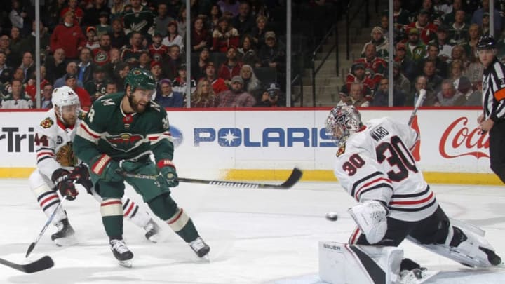 ST. PAUL, MN - OCTOBER 11: Jason Zucker #16 of the Minnesota Wild is stopped by Cam Ward #30 of the Chicago Blackhawks as Jan Rutta #44 of the Chicago Blackhawks defends during a game between the Minnesota Wild and Chicago Black Hawks at Xcel Energy Center on October 11, 2018 in St. Paul, Minnesota. The Wild defeated the Black Hawks 4-3 in overtime.(Photo by Bruce Kluckhohn/NHLI via Getty Images)