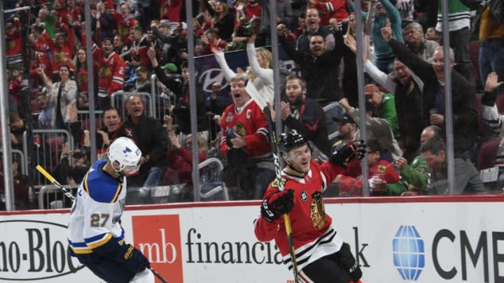 CHICAGO, IL - OCTOBER 13: Alex DeBrincat #12 of the Chicago Blackhawks celebrates his goal against the St. Louis Blues during the third period at the United Center on October 13, 2018 in Chicago, Illinois. (Photo by Bill Smith/NHLI via Getty Images)