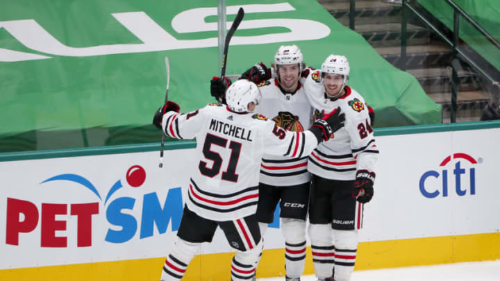 Ian Mitchell #51, Brandon Hagel #38, Pius Suter #24, Chicago Blackhawks (Photo by Tom Pennington/Getty Images)