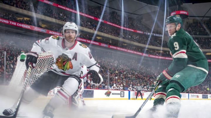 ST. PAUL, MN - FEBRUARY 10: Duncan Keith #2 of the Chicago Blackhawks and Mikko Koivu #9 of the Minnesota Wild skate to the puck during the game at the Xcel Energy Center on February 10, 2018 in St. Paul, Minnesota. (Photo by Bruce Kluckhohn/NHLI via Getty Images)