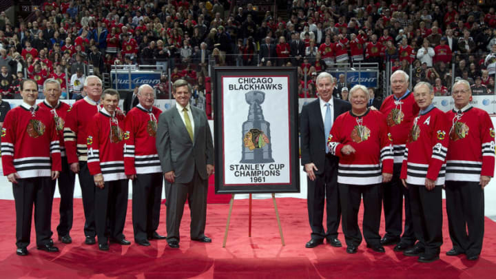 CHICAGO, IL - JANUARY 09: Former Chicago Blackhawks players from the 1961 Stanley Cup Championship team; Rob Crawford, Eric Nesterenko, Bill Hay, Stan Mikita, Glenn Hall, Bobby Hull, Ab McDonald, Pierre Pilote, and Wayne Hicks are honored by Chicago Blackhawks Chairman Rocky Wirtz and President John McDonough before the game against the New York Islanders on January 9, 2011 at the United Center in Chicago, Illinois. (Photo by Bill Smith/NHLI via Getty Images)