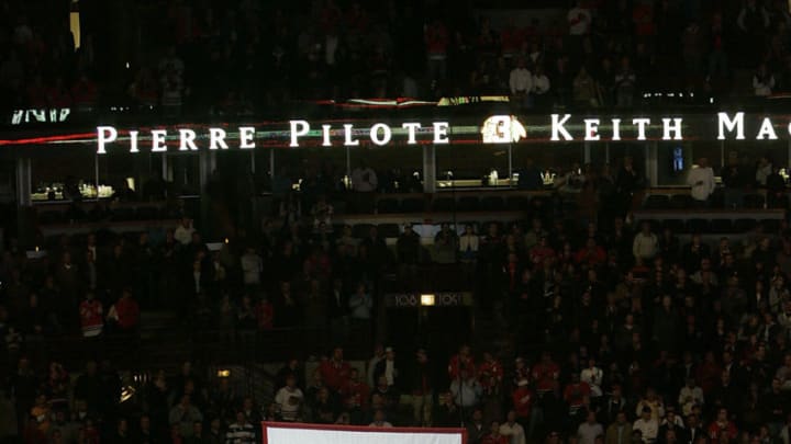 CHICAGO - NOVEMBER 12: A banner retiring the number of former Chicago Blackhawks defenseman and NHL hall of famer Pierre Pilote is raised during a ceremony before the Chicago Blackhawks Boston Bruins game at the United Center on November 12, 2008 in Chicago, Illinois. The ceremony honored Pilote and Keith Magnuson who also wore