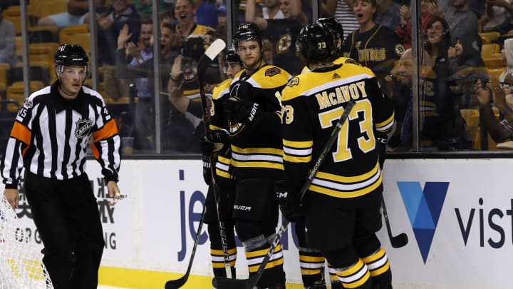 BOSTON, MA – SEPTEMBER 25: Boston Bruins right defenseman Charlie McAvoy (73) rushes in to congratulate Boston Bruins left wing Anders Bjork (10) after his goal during a preseason game between the Boston Bruins and the Chicago Blackhawks on September 25, 2017, at TD Garden in Boston, Massachusetts. (Photo by Fred Kfoury III/Icon Sportswire via Getty Images)