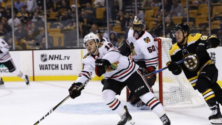 BOSTON, MA - SEPTEMBER 25: Chicago Blackhawks right wing Alex DeBrincat (12) moves the puck as Boston Bruins right wing David Pastrnak (88) closes in during a preseason game between the Boston Bruins and the Chicago Blackhawks on September 25, 2017, at TD Garden in Boston, Massachusetts. (Photo by Fred Kfoury III/Icon Sportswire via Getty Images) BOSTON, MA - SEPTEMBER 25: Chicago Blackhawks right wing Alex DeBrincat (12) moves the puck as Boston Bruins right wing David Pastrnak (88) closes in during a preseason game between the Boston Bruins and the Chicago Blackhawks on September 25, 2017, at TD Garden in Boston, Massachusetts. (Photo by Fred Kfoury III/Icon Sportswire via Getty Images)