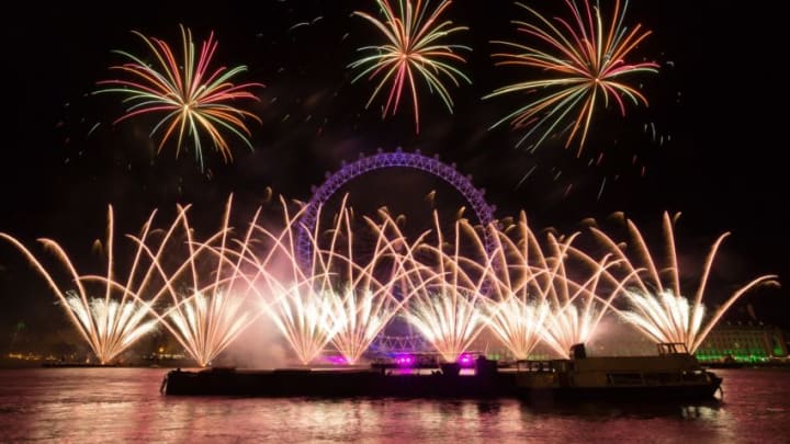 LONDON, UNITED KINGDOM - JANUARY 01: Fireworks light up the sky above the London Eye during the new year celebrations in London, United Kingdom on January 01, 2018. (Photo by Vickie Flores/Anadolu Agency/Getty Images)