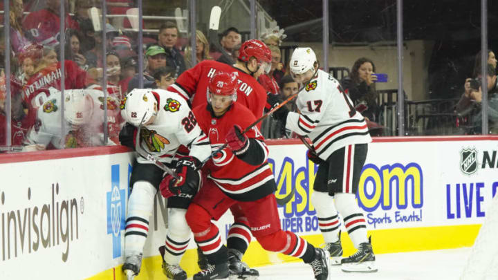 Oct 26, 2019; Raleigh, NC, USA; Carolina Hurricanes right wing Sebastian Aho (20) checks Chicago Blackhawks center Ryan Carpenter (22) during the second period at PNC Arena. Mandatory Credit: James Guillory-USA TODAY Sports Oct 26, 2019; Raleigh, NC, USA; Carolina Hurricanes right wing Sebastian Aho (20) checks Chicago Blackhawks center Ryan Carpenter (22) during the second period at PNC Arena. Mandatory Credit: James Guillory-USA TODAY Sports