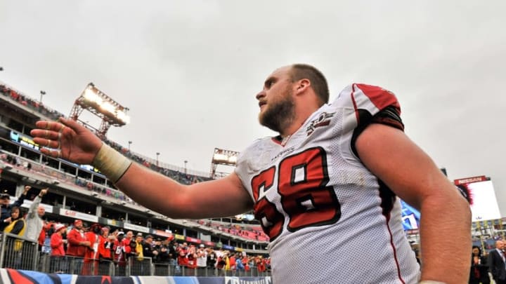 Oct 25, 2015; Nashville, TN, USA; Atlanta Falcons center Mike Person (68) tosses his glove into the stands as he exits the field after defeating the Tennessee Titans during the second half at Nissan Stadium. Atlanta won 10-7. Mandatory Credit: Jim Brown-USA TODAY Sports