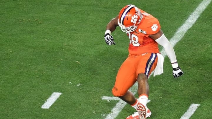 Jan 11, 2016; Glendale, AZ, USA; Clemson Tigers defensive end Kevin Dodd (98) celebrates a quarterback tackle during the second quarter against the Alabama Crimson Tide in the 2016 CFP National Championship at University of Phoenix Stadium. Mandatory Credit: Gary A. Vasquez-USA TODAY Sports