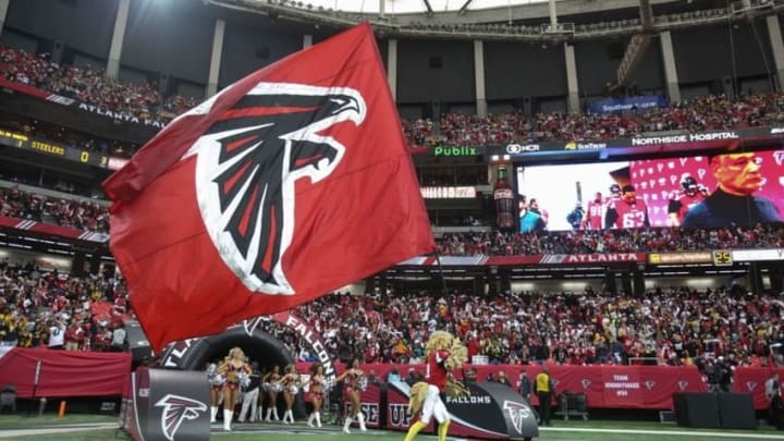 Dec 14, 2014; Atlanta, GA, USA; Atlanta Falcons mascot Freddie Falcon waves the Falcons flag before their game against the Pittsburgh Steelers at the Georgia Dome. The Steelers won 27-20. Mandatory Credit: Jason Getz-USA TODAY Sports