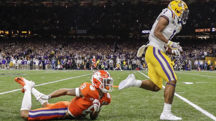 NEW ORLEANS, LA - JANUARY 13: Wide Receiver Ja'Marr Chase #1 of the LSU Tigers makes a catch over Cornerback A.J. Terrell #8 of the Clemson Tigers for a touchdown during the College Football Playoff National Championship game at the Mercedes-Benz Superdome on January 13, 2020 in New Orleans, Louisiana. LSU defeated Clemson 42 to 25. (Photo by Don Juan Moore/Getty Images)