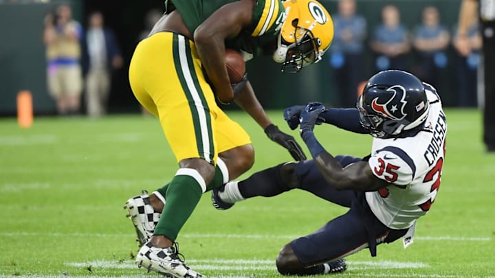 GREEN BAY, WISCONSIN – AUGUST 14: Devin Funchess #11 of the Green Bay Packers breaks the tackle of Keion Crossen #35 of the Houston Texans in the first half of a preseason game at Lambeau Field on August 14, 2021 in Green Bay, Wisconsin. (Photo by Quinn Harris/Getty Images)