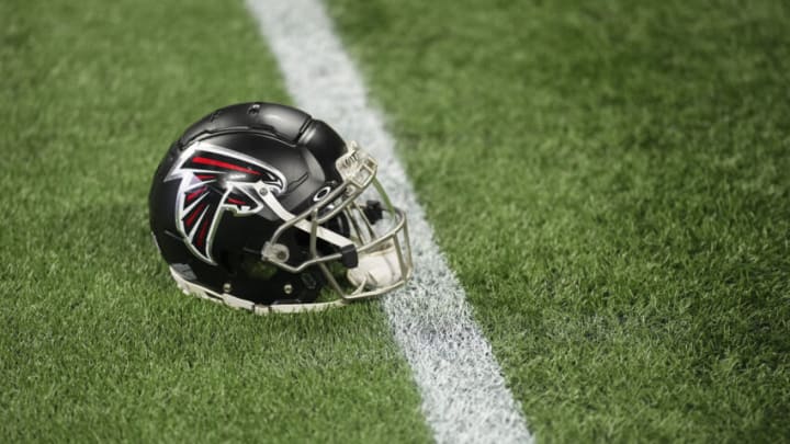 ATLANTA, GA - JANUARY 08: A close up view of an Atlanta Falcons helmet on the turf prior to the game against the Tampa Bay Buccaneers at Mercedes-Benz Stadium on January 8, 2023 in Atlanta, Georgia. (Photo by Cooper Neill/Getty Images)