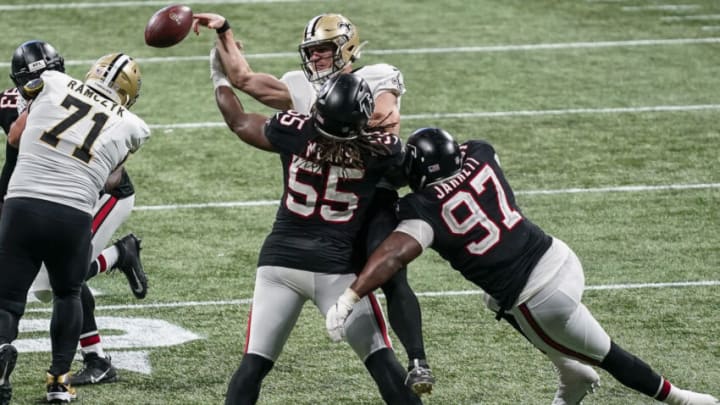 Dec 6, 2020; Atlanta, Georgia, USA; Atlanta Falcons defensive end Steven Means (55) hits New Orleans Saints quarterback Taysom Hill (7) causing a fumble recovered by the Falcons during the second half at Mercedes-Benz Stadium. Mandatory Credit: Dale Zanine-USA TODAY Sports