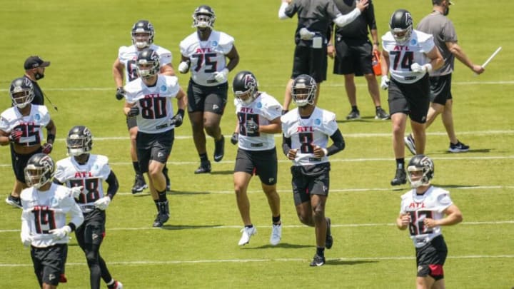 May 14, 2021; Flowery Branch, Georgia, USA; Atlanta Falcons tight end Kyle Pitts (8) runs with teammates on the field during rookie camp at the Falcons Training Facility. Mandatory Credit: Dale Zanine-USA TODAY Sports
