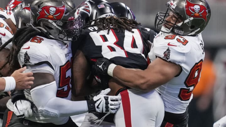 Dec 5, 2021; Atlanta, Georgia, USA; Tampa Bay Buccaneers defensive tackle Rakeem Nunez-Roches (56) and defensive tackle Ndamukong Suh (93) tackle Atlanta Falcons running back Cordarrelle Patterson (84) during the second half at Mercedes-Benz Stadium. Mandatory Credit: Dale Zanine-USA TODAY Sports