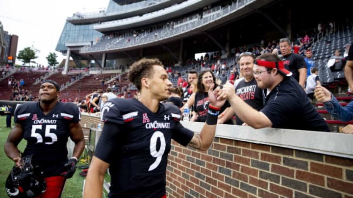 Cincinnati Bearcats quarterback Desmond Ridder (9) fist bumps a fan after the NCAA football game on Saturday, Sept. 4, 2021, at Nippert Stadium in Cincinnati.Cincinnati Bearcats Miami Redhawks