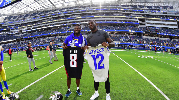 Sep 18, 2022; Inglewood, California, USA; Los Angeles Rams wide receiver Van Jefferson (12) and Atlanta Falcons tight end Kyle Pitts (8) exchange jerseys following the game at SoFi Stadium. Mandatory Credit: Gary A. Vasquez-USA TODAY Sports