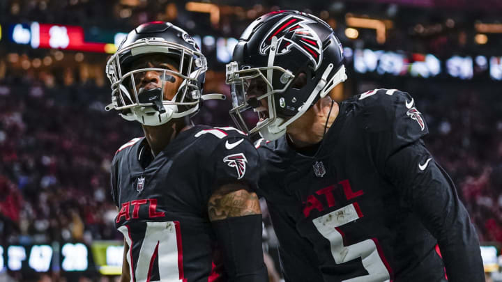 Oct 30, 2022; Atlanta, Georgia, USA; Atlanta Falcons wide receiver Damiere Byrd (14) reacts with wide receiver Drake London (5) after scoring a touchdown after catching a pass against the Carolina Panthers during the second half at Mercedes-Benz Stadium. Mandatory Credit: Dale Zanine-USA TODAY Sports