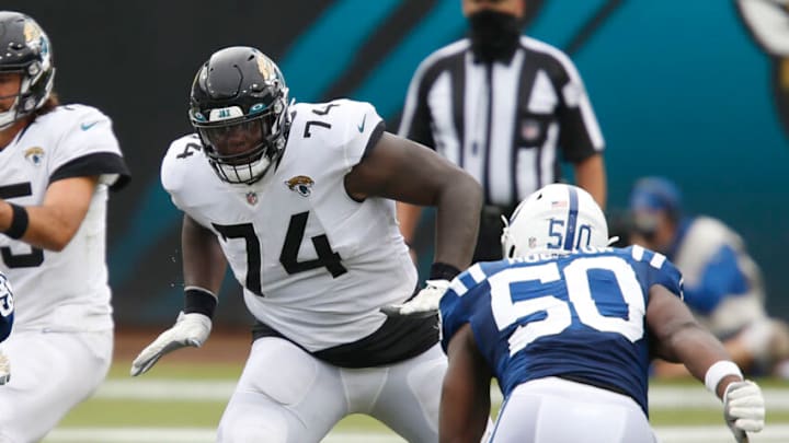 Sep 13, 2020; Jacksonville, Florida, USA; Jacksonville Jaguars offensive tackle Cam Robinson (74) protects the line from the rushing Indianapolis Colts defensive end Justin Houston (50) during the second half at TIAA Bank Field. Mandatory Credit: Reinhold Matay-USA TODAY Sports