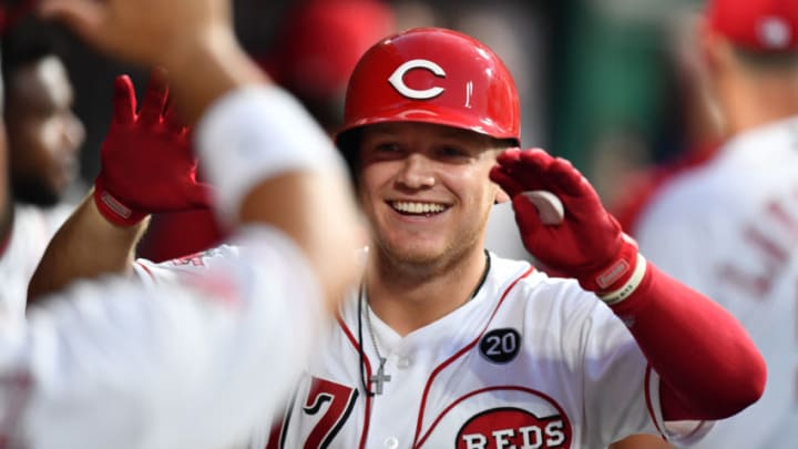 CINCINNATI, OH - JULY 20: Josh VanMeter #17 of the Cincinnati Reds celebrates in the dugout after hitting a two-run home run in the seventh inning against the St. Louis Cardinals at Great American Ball Park on July 20, 2019 in Cincinnati, Ohio. Cincinnati defeated St. Louis 3-2. (Photo by Jamie Sabau/Getty Images)