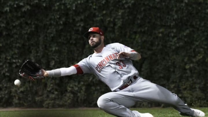 CHICAGO, ILLINOIS - JULY 16: Jesse Winker #33 of the Cincinnati Reds can't catch a double hit by Anthony Rizzo #44 of the Chicago Cubs during the sixth inning at Wrigley Field on July 16, 2019 in Chicago, Illinois. (Photo by David Banks/Getty Images)