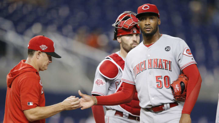 MIAMI, FLORIDA - AUGUST 27: Manager David Bell #25 of the Cincinnati Reds takes Amir Garrett #50 out of the game against the Miami Marlins. (Photo by Michael Reaves/Getty Images)