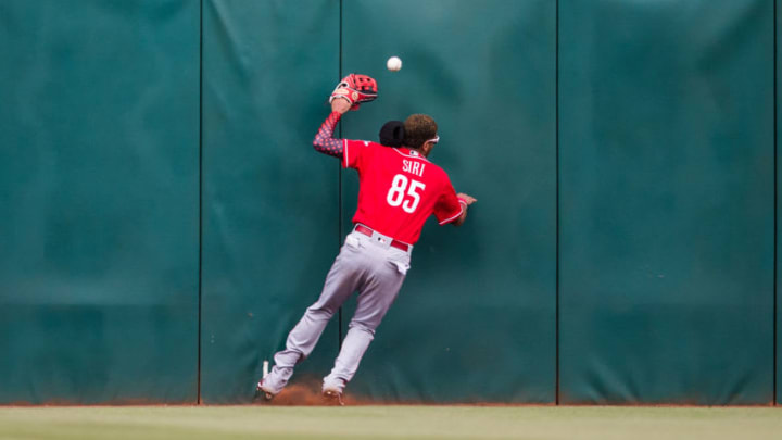GOODYEAR, AZ - FEBRUARY 23: Jose Siri #85 of the Cincinnati Reds bats slams hard into the wall on a ball hit by Richie Shaffer of the Cleveland Indians in the 8th inning during a Spring Training Game at Goodyear Ballpark on February 23, 2018 in Goodyear, Arizona. (Photo by Rob Tringali/Getty Images)