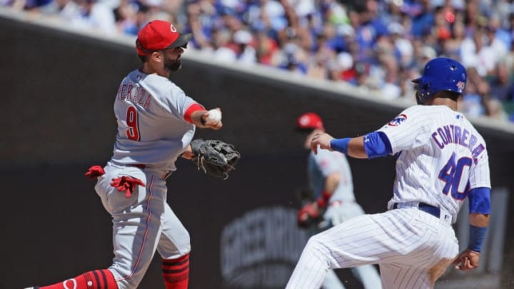 CHICAGO, IL - JULY 06: Jose Peraza #9 of the Cincinnati Reds forces Willson Contreras #40 of the Chicago Cubs in the 7th inning at Wrigley Field on July 6, 2018 in Chicago, Illinois. The Reds defeated the Cubs 3-2. (Photo by Jonathan Daniel/Getty Images)