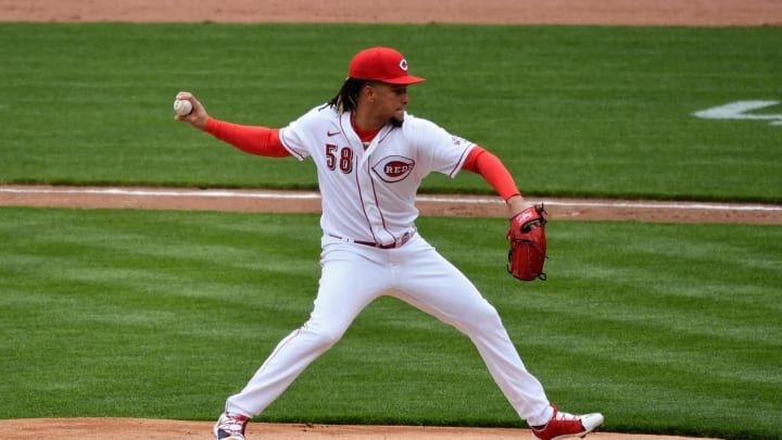 Luis Castillo #58 of the Cincinnati Reds pitches against the St. Louis Cardinals on Opening Day