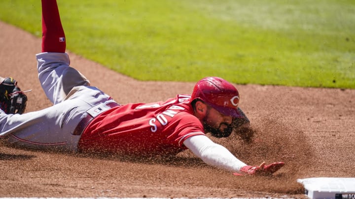 Cincinnati Reds right fielder Nick Castellanos (2) tagged out on the leg by Atlanta Braves third baseman Austin Riley