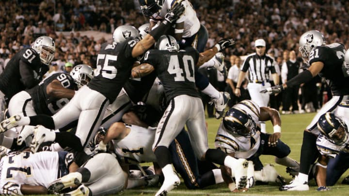 San Diego runningback LaDainian Tomlinson goes up high for the first touchdown of the game as the San Diego Chargers defeated the Oakland Raiders by a score of 27 to 0 at McAfee Coliseum, Oakland, California, September 11, 2006. (Photo by Robert B. Stanton/NFLPhotoLibrary)