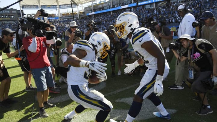 CARSON, CA - SEPTEMBER 08: Running back Austin Ekeler #30 of the Los Angeles Chargers dances with Justin Jackson #22 at the end of the game after scoring the winning touchdown in overtime against Indianapolis Colts at Dignity Health Sports Park on September 8, 2019 in Carson, California. (Photo by Kevork Djansezian/Getty Images)