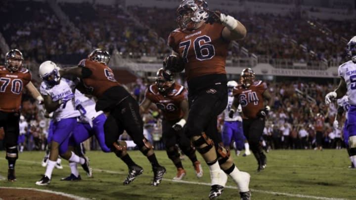 BOCA RATON, FL - DECEMBER 20: Forrest Lamp #76 of the Western Kentucky Hilltoppers scores a touchdown during the first half of the game against the Memphis Tigers at FAU Stadium on December 20, 2016 in Boca Raton, Florida. (Photo by Rob Foldy/Getty Images)