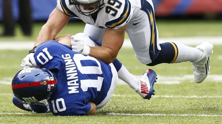 EAST RUTHERFORD, NJ - OCTOBER 08: Joey Bosa #99 of the Los Angeles Chargers sacks Eli Manning #10 of the New York Giants during their game at MetLife Stadium on October 8, 2017 in East Rutherford, New Jersey. (Photo by Jeff Zelevansky/Getty Images)