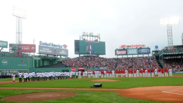 Oct 2, 2016; Boston, MA, USA; Members of the 2004 2007 an 2013 World Series team as well as current players lineup for the national anthem prior to a game against the Toronto Blue Jays at Fenway Park. Mandatory Credit: Bob DeChiara-USA TODAY Sports