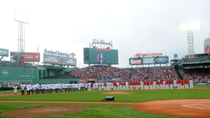 Oct 2, 2016; Boston, MA, USA; Members of the 2004 2007 an 2013 World Series team as well as current players lineup for the national anthem prior to a game against the Toronto Blue Jays at Fenway Park. Mandatory Credit: Bob DeChiara-USA TODAY Sports