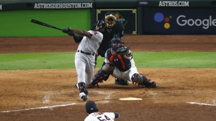 HOUSTON, TX - OCTOBER 16: Jackie Bradley Jr. #19 of the Boston Red Sox hits a grand slam against Roberto Osuna #54 of the Houston Astros in the eighth inning during Game Three of the American League Championship Series at Minute Maid Park on October 16, 2018 in Houston, Texas. (Photo by Tim Warner/Getty Images)