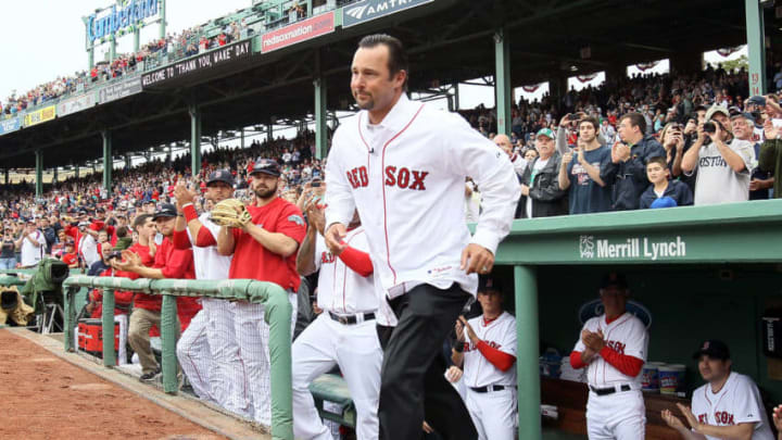 BOSTON, MA - MAY 15: Former Red Sox pitcher Tim Wakefield runs out on to the field before the game against the Seattle Mariners on May 15, 2012 at Fenway Park in Boston, Massachusetts. Wakefield was honored in a pregame ceremony by the Boston Red Sox. (Photo by Elsa/Getty Images)