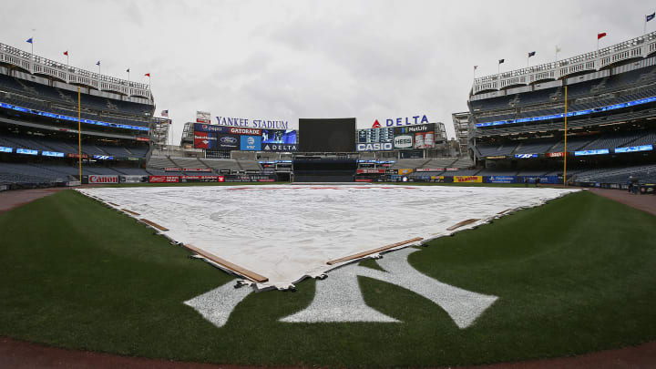NEW YORK, NY – AUGUST 29: The tarp covers the infield as the game between the Cleveland Indians and New York Yankees has been postponed due to rain at Yankee Stadium on August 29, 2017 in the Bronx borough of New York City. (Photo by Rich Schultz/Getty Images)