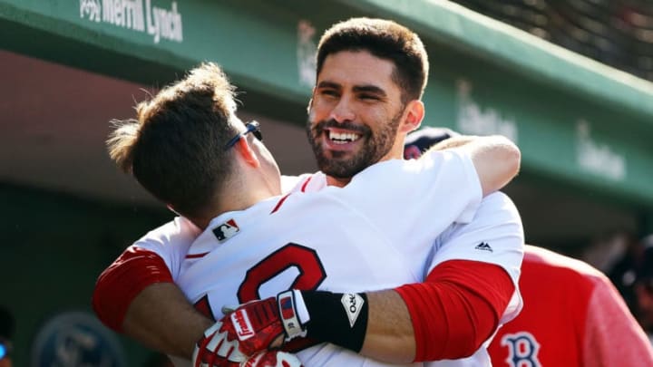 BOSTON, MA - AUGUST 04: J.D. Martinez #28 hugs Brock Holt #12 of the Boston Red Sox when he returns to the dugout after hitting a solo home run in the fourth inning of a game against the New York Yankees at Fenway Park on August 4, 2018 in Boston, Massachusetts. (Photo by Adam Glanzman/Getty Images)