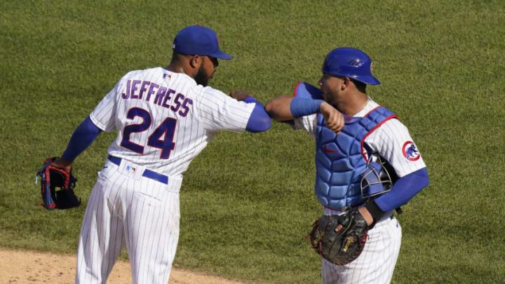 CHICAGO, ILLINOIS - JULY 26: Jeremy Jeffress #24 of the Chicago Cubs and Willson Contreras #40 of the Chicago Cubs celebrate at the end of their team's 9-1 win over the Milwaukee Brewers at Wrigley Field on July 26, 2020 in Chicago, Illinois. The 2020 season had been postponed since March due to the COVID-19 pandemic. (Photo by Nuccio DiNuzzo/Getty Images)
