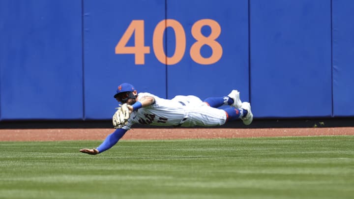 NEW YORK, NEW YORK - JUNE 27: Kevin Pillar #11 of the New York Mets makes a diving catch in the first inning against the Philadelphia Phillies during their game at Citi Field on June 27, 2021 in New York City. (Photo by Al Bello/Getty Images)