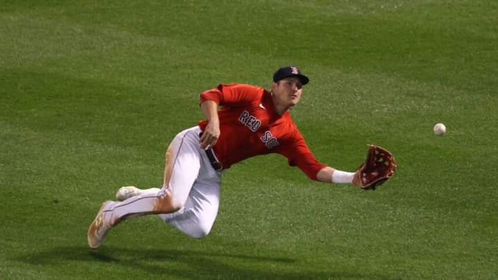 BOSTON, MASSACHUSETTS - OCTOBER 18: Hunter Renfroe #10 of the Boston Red Sox catches a ball hit by Carlos Correa #1 of the Houston Astros for the final out of Game Three of the American League Championship Series at Fenway Park on October 18, 2021 in Boston, Massachusetts. (Photo by Omar Rawlings/Getty Images)