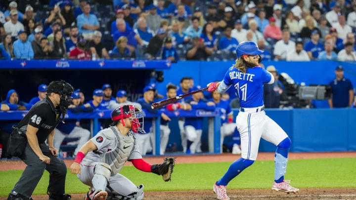 TORONTO, ON – JUNE 28: Bo Bichette #11 of the Toronto Blue Jays hits a RBI single to tie the game against the Boston Red Sox in the ninth inning during their MLB game at the Rogers Centre on June 28, 2022 in Toronto, Ontario, Canada. (Photo by Mark Blinch/Getty Images)