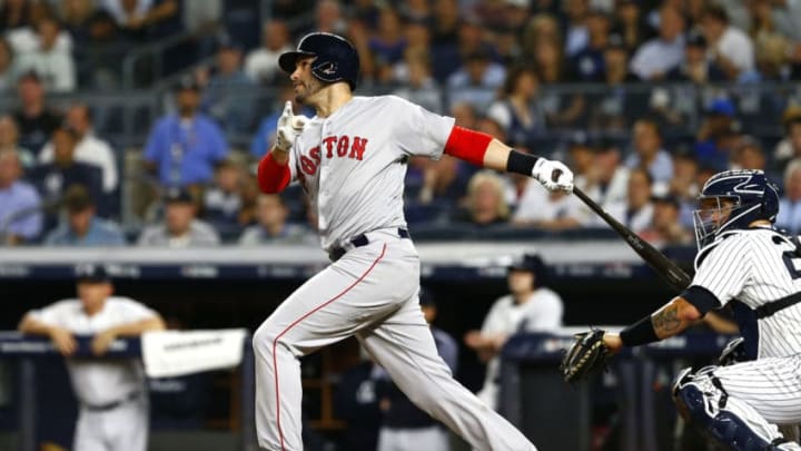 NEW YORK, NEW YORK - OCTOBER 09: J.D. Martinez #28 of the Boston Red Sox hits a sacrifice fly RBI to score Andrew Benintendi #16 against CC Sabathia #52 of the New York Yankees during the third inning in Game Four of the American League Division Series at Yankee Stadium on October 09, 2018 in the Bronx borough of New York City. (Photo by Mike Stobe/Getty Images)