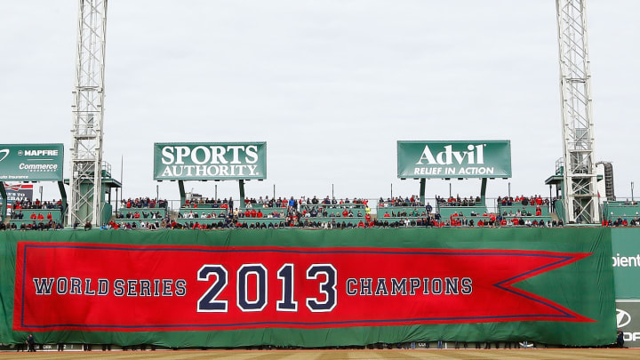 BOSTON, MA – APRIL 04: The 2013 World Series Champions Boston Red Sox banner is draped across the Green Monster prior to the Opening Day game between the Boston Red Sox and the Milwaukee Brewers at Fenway Park on April 4, 2014 in Boston, Massachusetts. (Photo by Jared Wickerham/Getty Images)